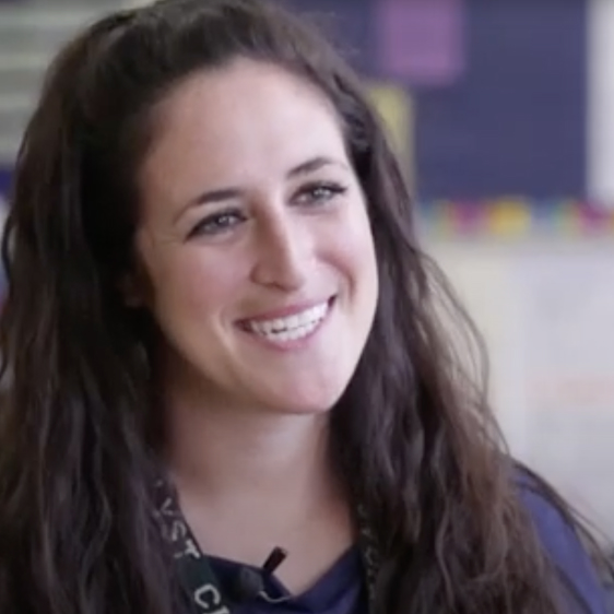 Photo of a teacher talking to camera